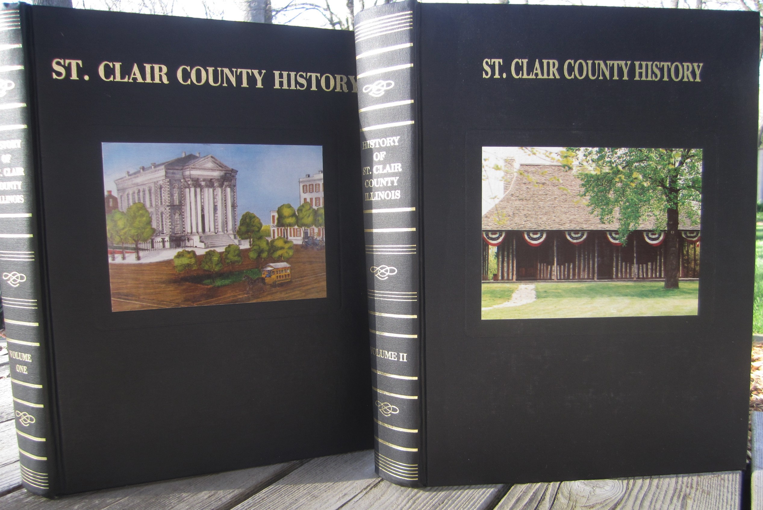 St. Clair County History, Volume I (1988), Volume II (1992) book covers feature color photos of the courthouse at Cahokia and Belleville